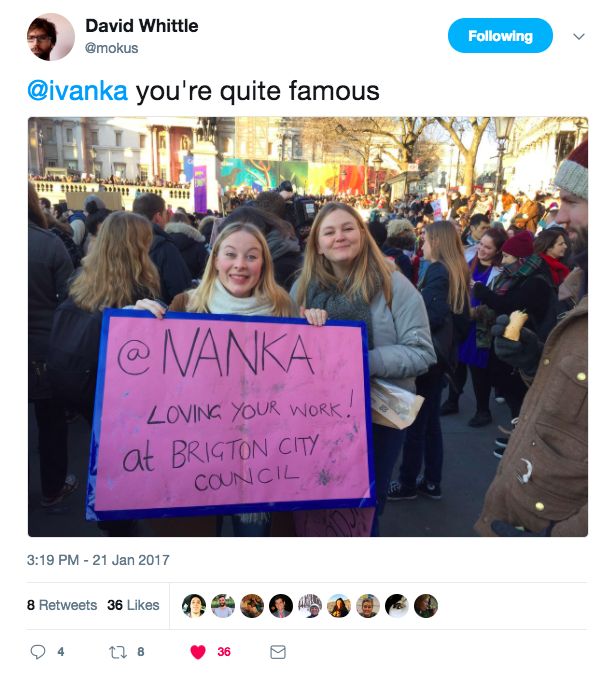 Two young women at the Women's March in London holding up a banner which says @ ivanka we love your work at Brighton Council